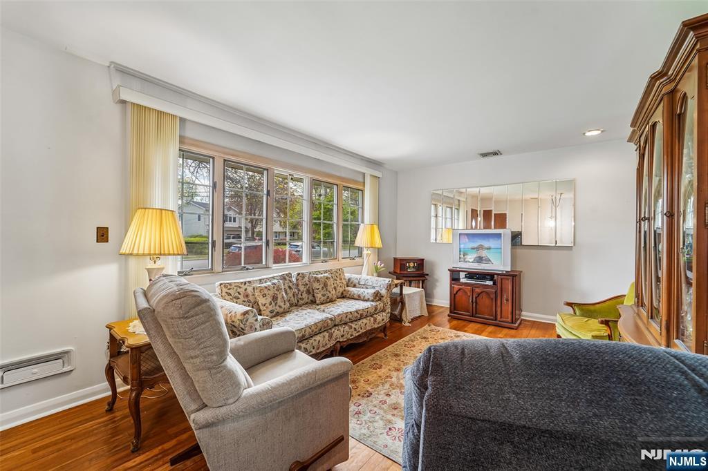 193 Homestead Road Paramus, NJ 07652 - Photo 7 of 33 a living room with furniture and a floor to ceiling window