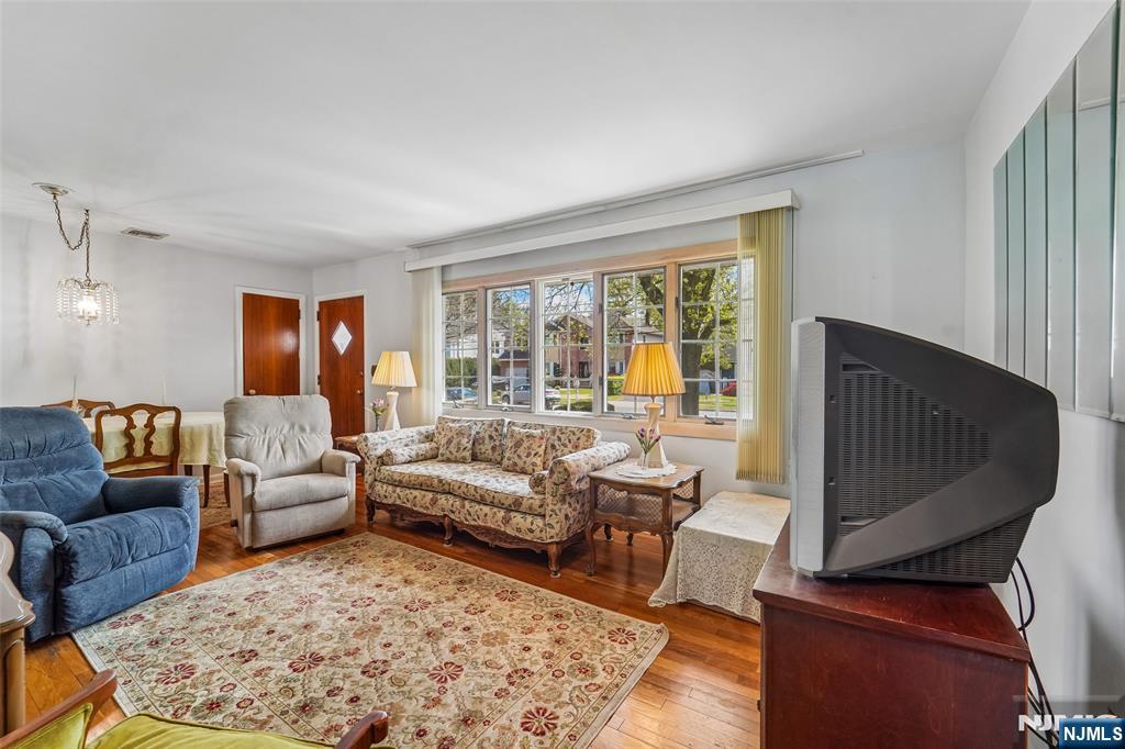 193 Homestead Road Paramus, NJ 07652 - Photo 8 of 33 a living room with furniture and a flat screen tv
