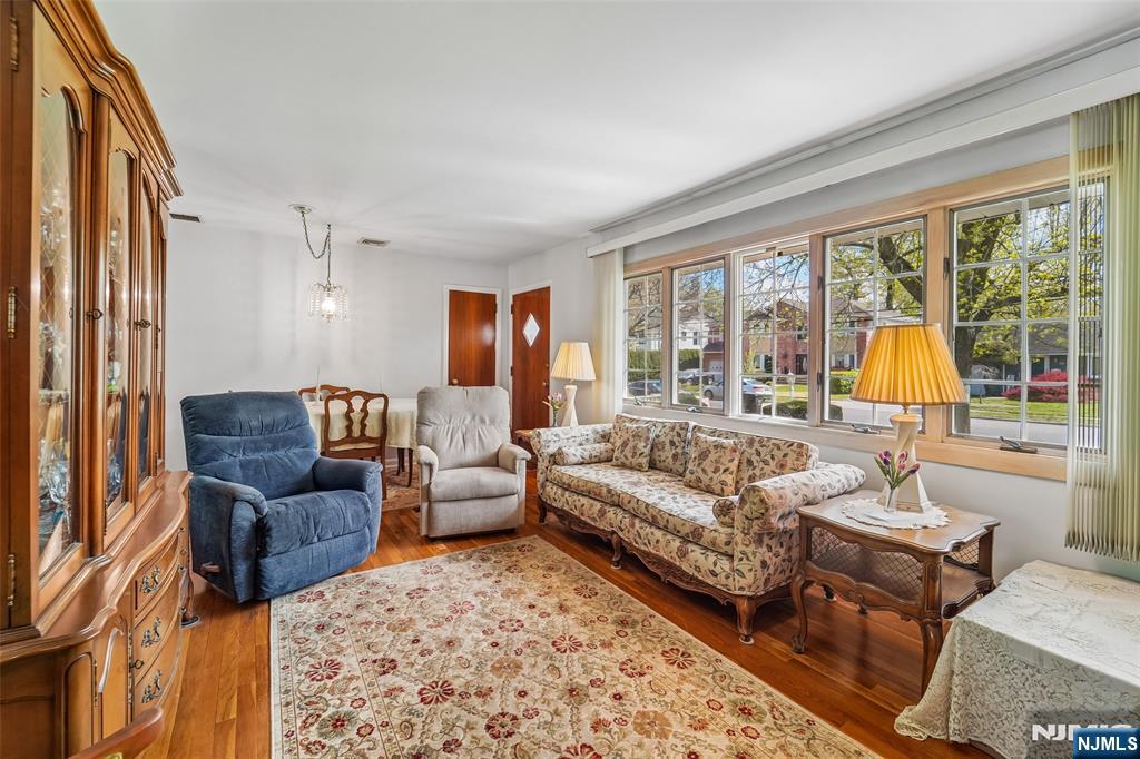 193 Homestead Road Paramus, NJ 07652 - Photo 9 of 33 a living room with furniture and a large window