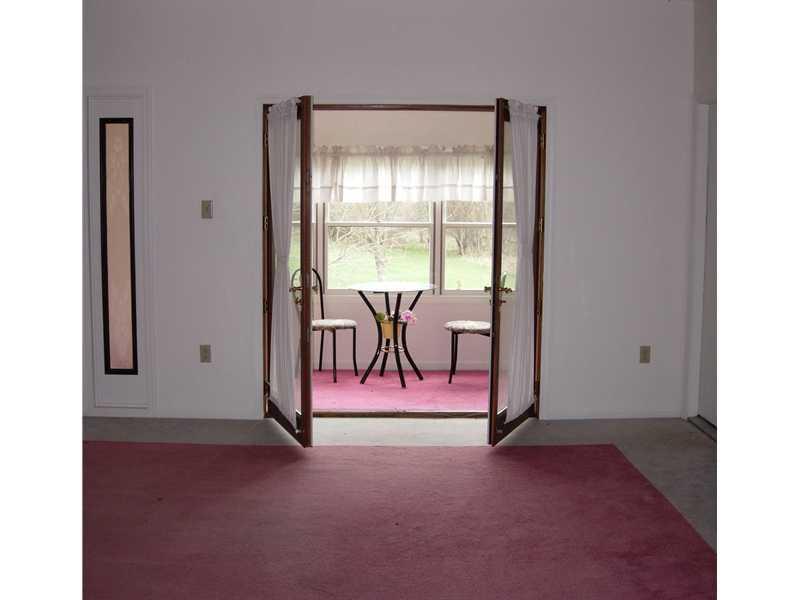9962 Grubbs Road Wexford, PA 15090 - Photo 3 of 15 Living Room. Living room has atriam with electric fireplace. Watch the turkeys and deer from your living room.