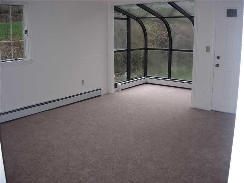 9962 Grubbs Road Wexford, PA 15090 - Photo 5 of 15 Living Room. On other side of house, (Mother in law suite perhaps) is the living room/dining room with its own atrium and door to covered back porch.