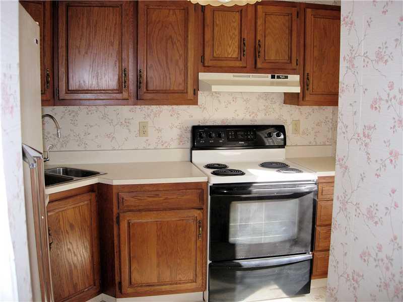 9962 Grubbs Road Wexford, PA 15090 - Photo 6 of 15 Kitchen. One of two kitchens. with electric stove and double door refrigerator. Nice and bright