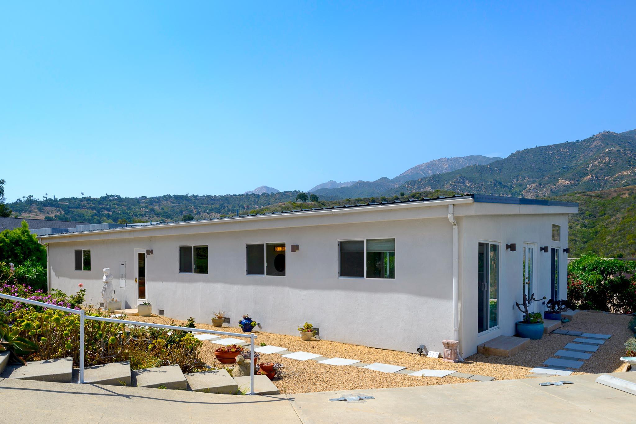 317 Conejo Road Santa Barbara, CA 93103 - Photo 1 of 15 a front view of a house with a yard