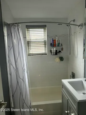 a bathroom with a shower and a tub