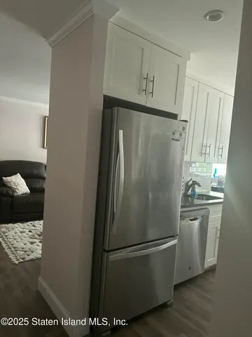 a white refrigerator freezer sitting in a kitchen