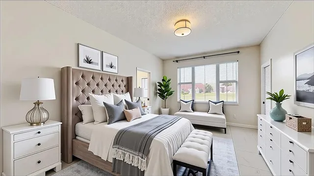 a bedroom with a bed and a couch