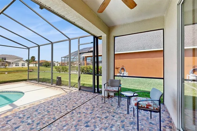 a view of a swimming pool with a yard