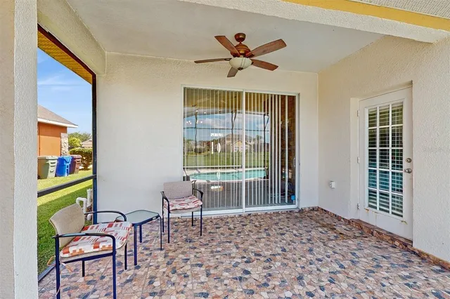 a view of a swimming pool with a yard