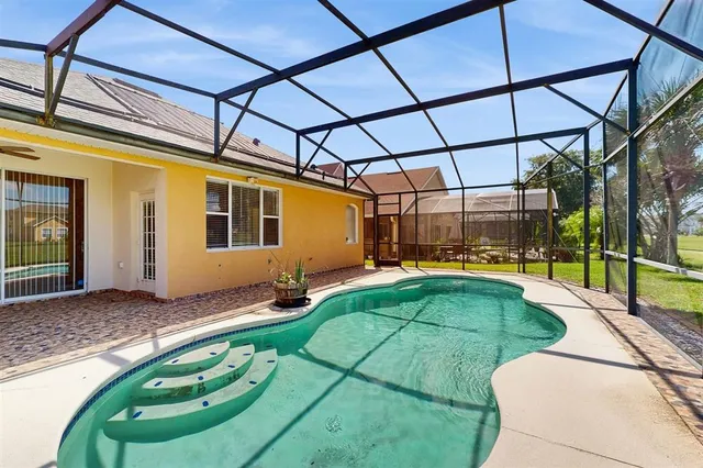 a view of a swimming pool with an outdoor space