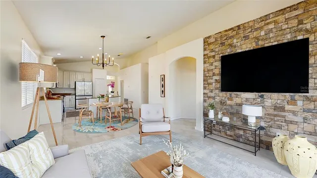 a living room with furniture and a flat screen tv