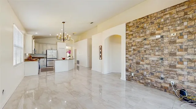 a view of a kitchen with a sink and cabinets
