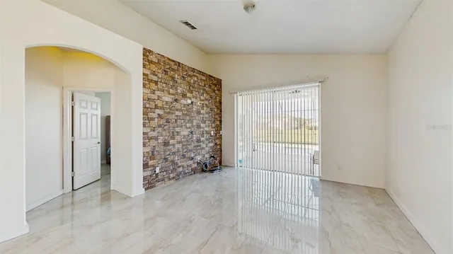 a view of empty room with natural light
