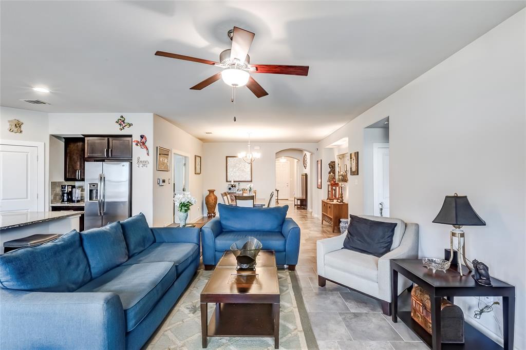 231 Windswept Way Kyle, TX 78640 - Photo 6 of 33 Living area featuring arched walkways and a ceiling fan