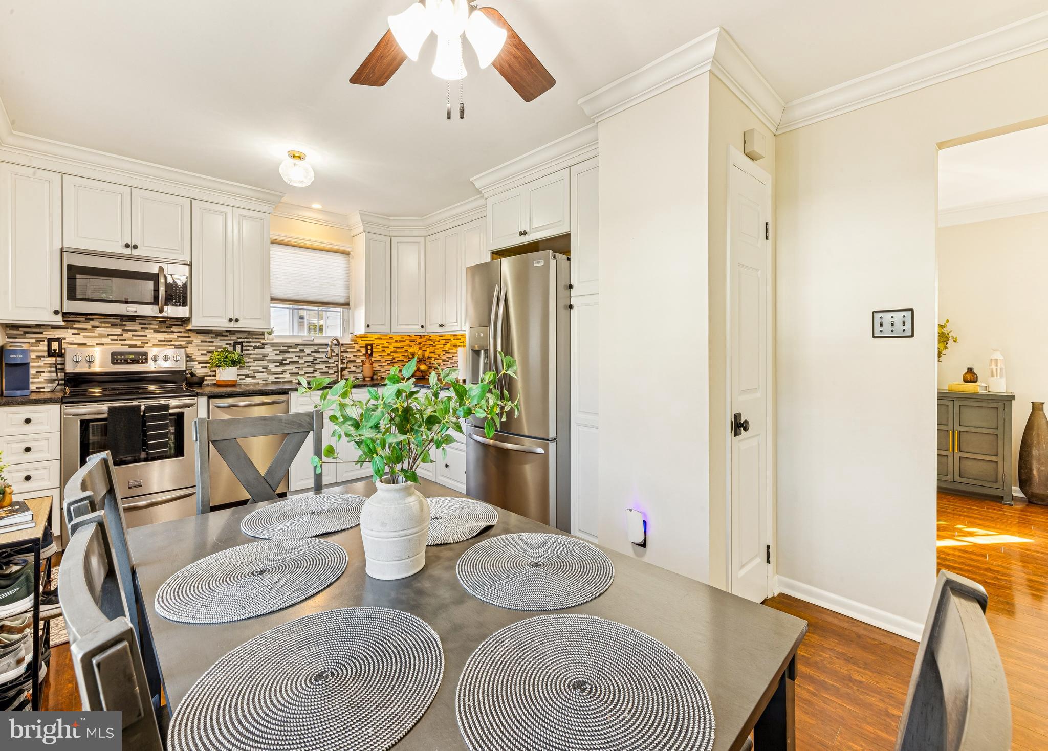 224 Hurffville Grenloch Road Sewell, NJ 08080 - Photo 8 of 23 a kitchen with stainless steel appliances granite countertop a dining table chairs and a refrigerator