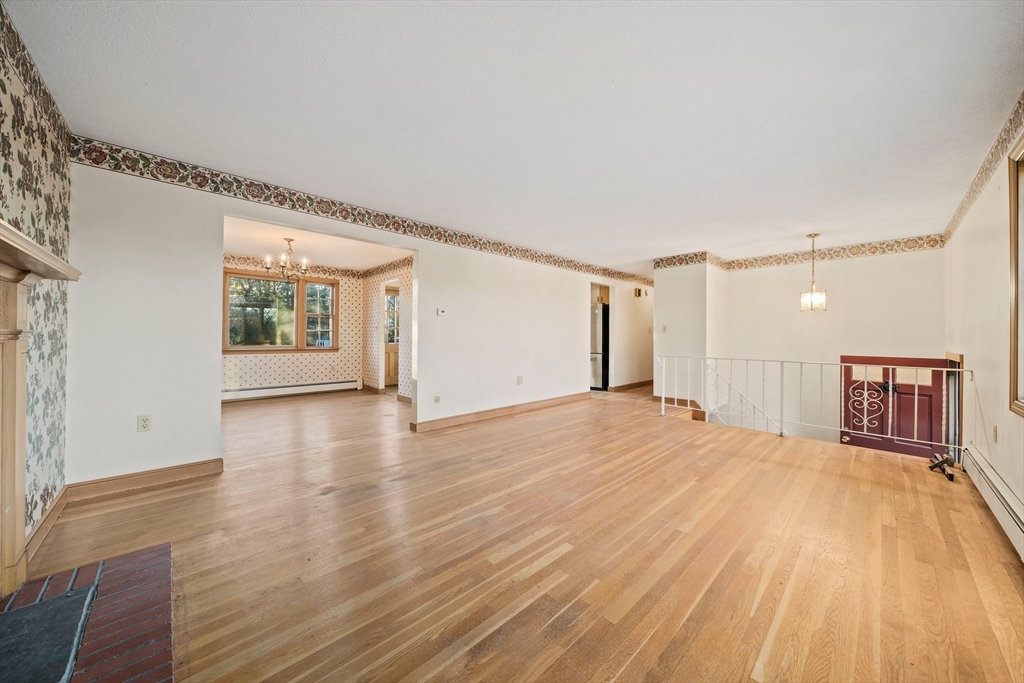 59 Windsor Road Weymouth, MA 02190 - Photo 11 of 39 a view of a room with wooden floor and windows