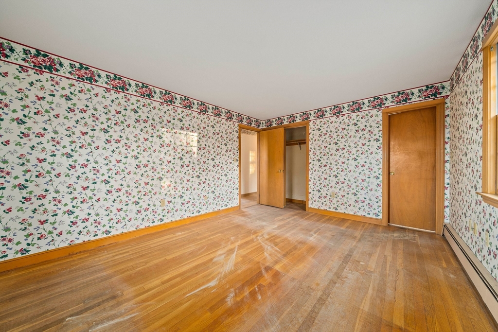 59 Windsor Road Weymouth, MA 02190 - Photo 14 of 39 a view of an empty room with wooden floor and a window
