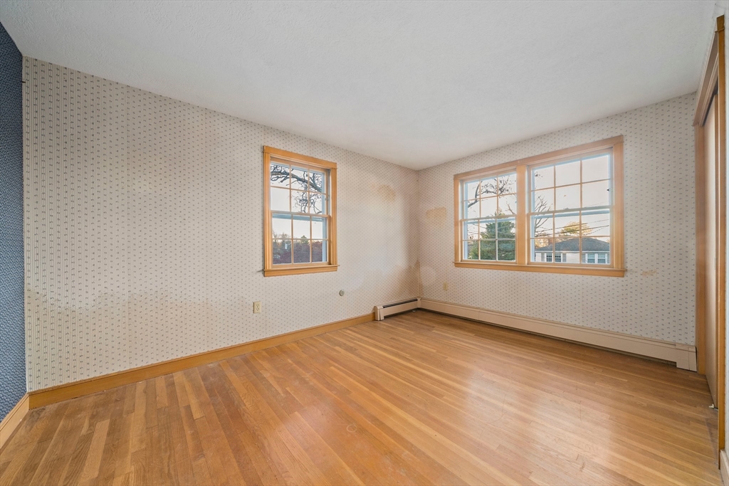 59 Windsor Road Weymouth, MA 02190 - Photo 15 of 39 an empty room with wooden floor and windows
