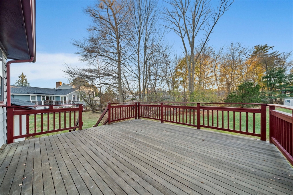 59 Windsor Road Weymouth, MA 02190 - Photo 26 of 39 a view of deck with large trees and wooden floor