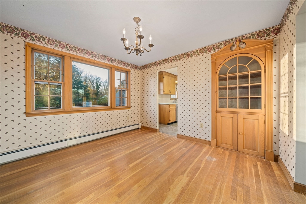 59 Windsor Road Weymouth, MA 02190 - Photo 9 of 39 a view of empty room with wooden floor and fan