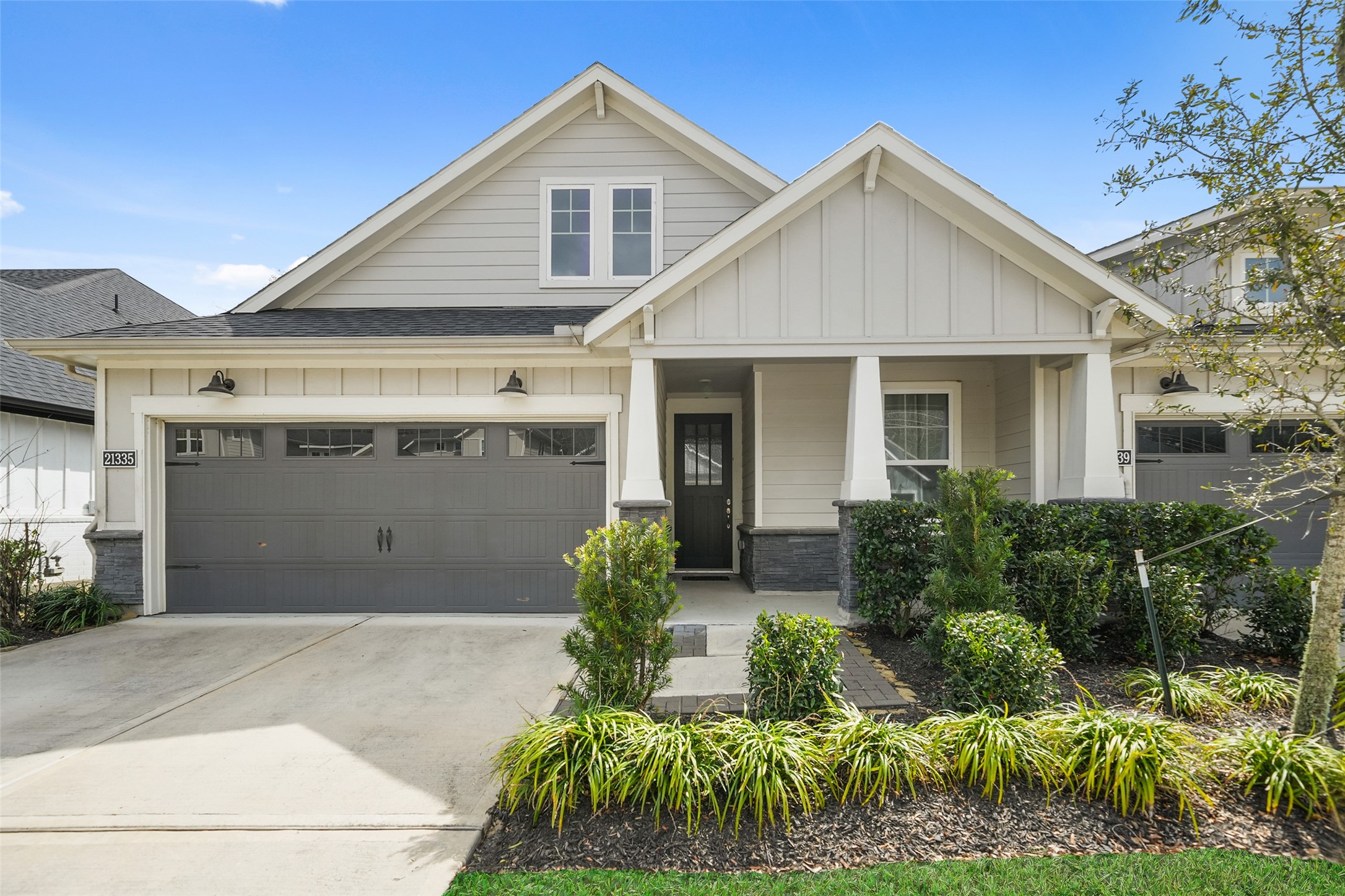 a front view of house with a garden