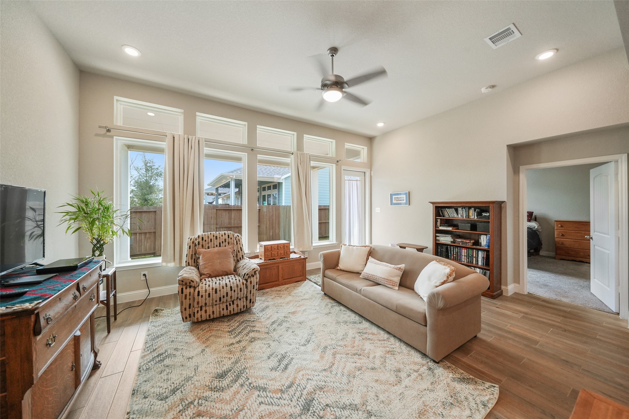 21335 Sierra Point Lane Porter, TX 77365 - Photo 12 of 33 a living room with furniture and a flat screen tv