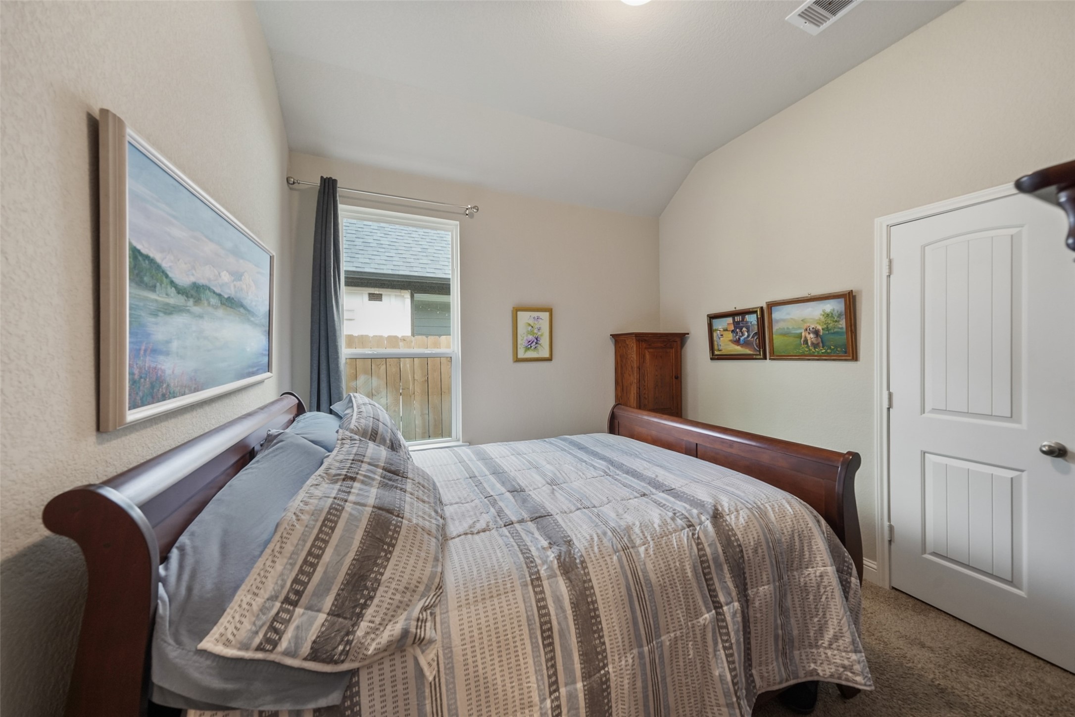 21335 Sierra Point Lane Porter, TX 77365 - Photo 16 of 33 a bed sitting in a bedroom next to a window