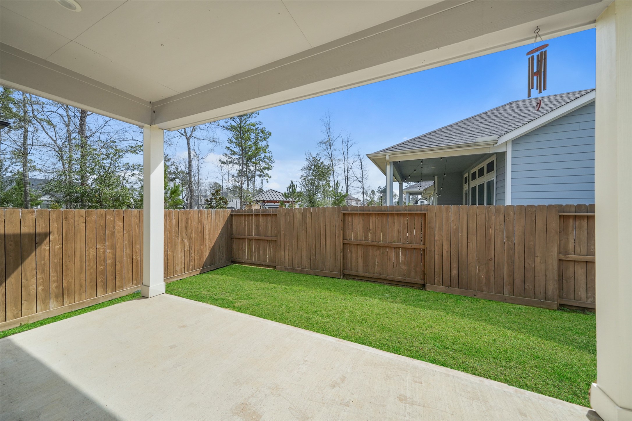 21335 Sierra Point Lane Porter, TX 77365 - Photo 20 of 33 a view of a backyard with wooden fence