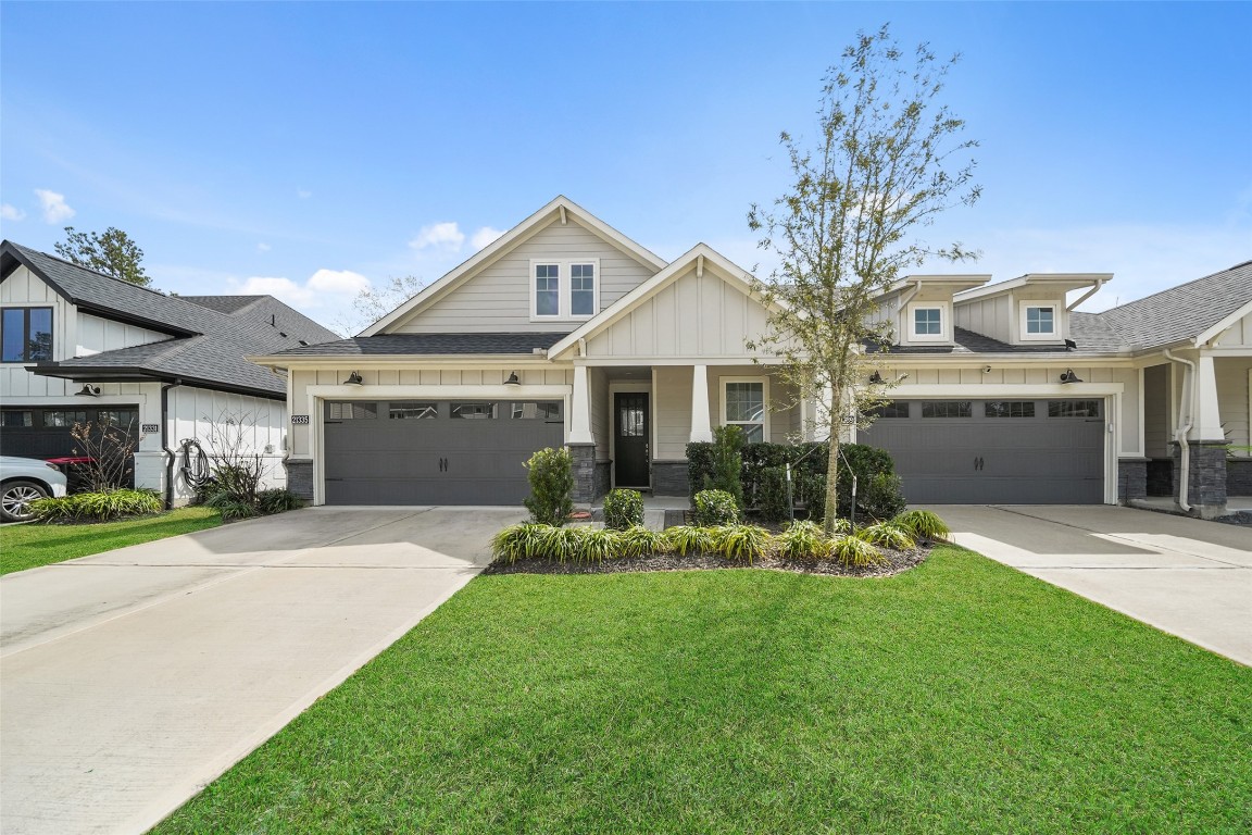 21335 Sierra Point Lane Porter, TX 77365 - Photo 24 of 33 a front view of a house with a yard and porch