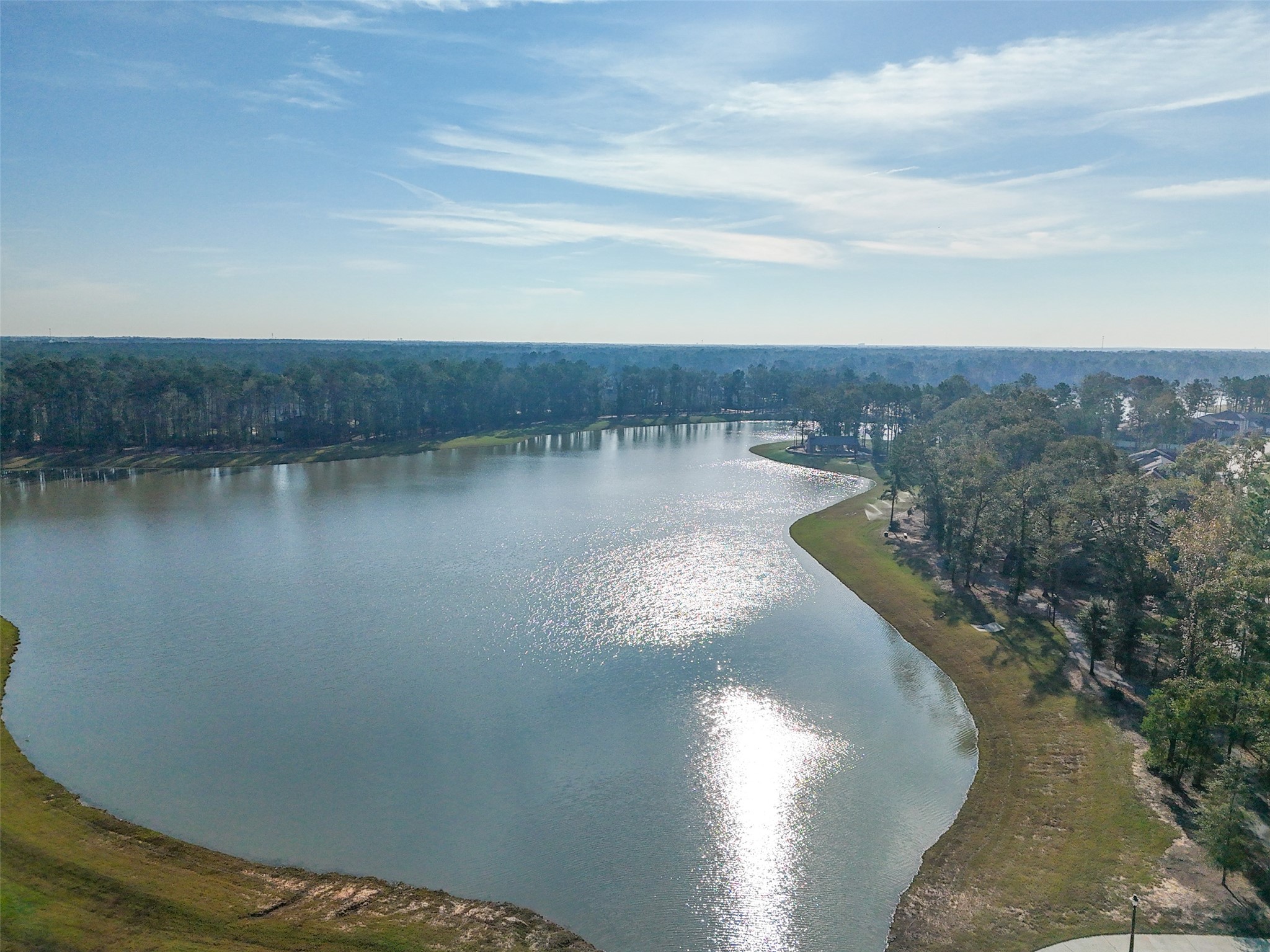 21335 Sierra Point Lane Porter, TX 77365 - Photo 28 of 33 a view of a lake from a yard