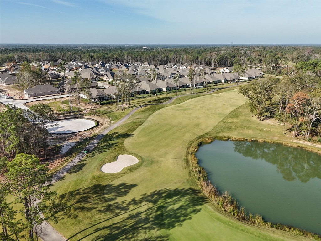 21335 Sierra Point Lane Porter, TX 77365 - Photo 31 of 33 an aerial view of residential houses with outdoor space