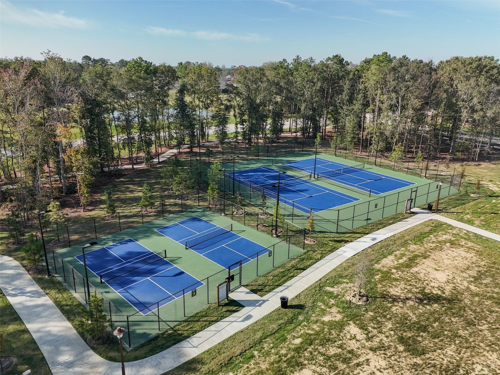 21335 Sierra Point Lane Porter, TX 77365 - Photo 32 of 33 a view of a backyard with sitting area