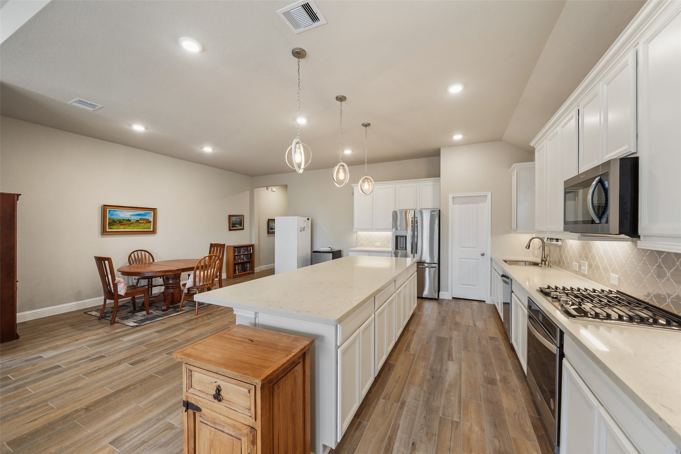 21335 Sierra Point Lane Porter, TX 77365 - Photo 7 of 33 a large kitchen with a table and chairs