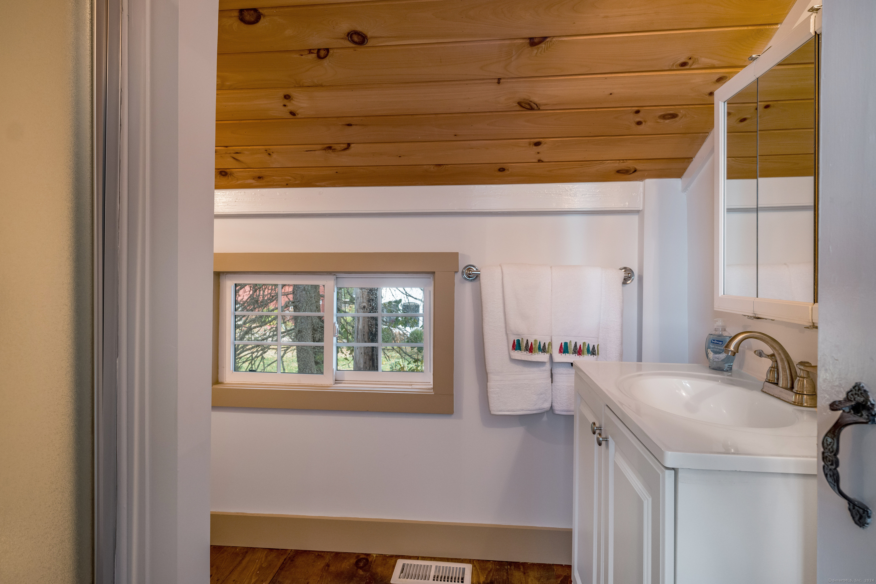 97 Commerce Street Clinton, CT 06413 - Photo 16 of 20 Accessory/bedroom full bath with angled ceiling in refinished hardwood.