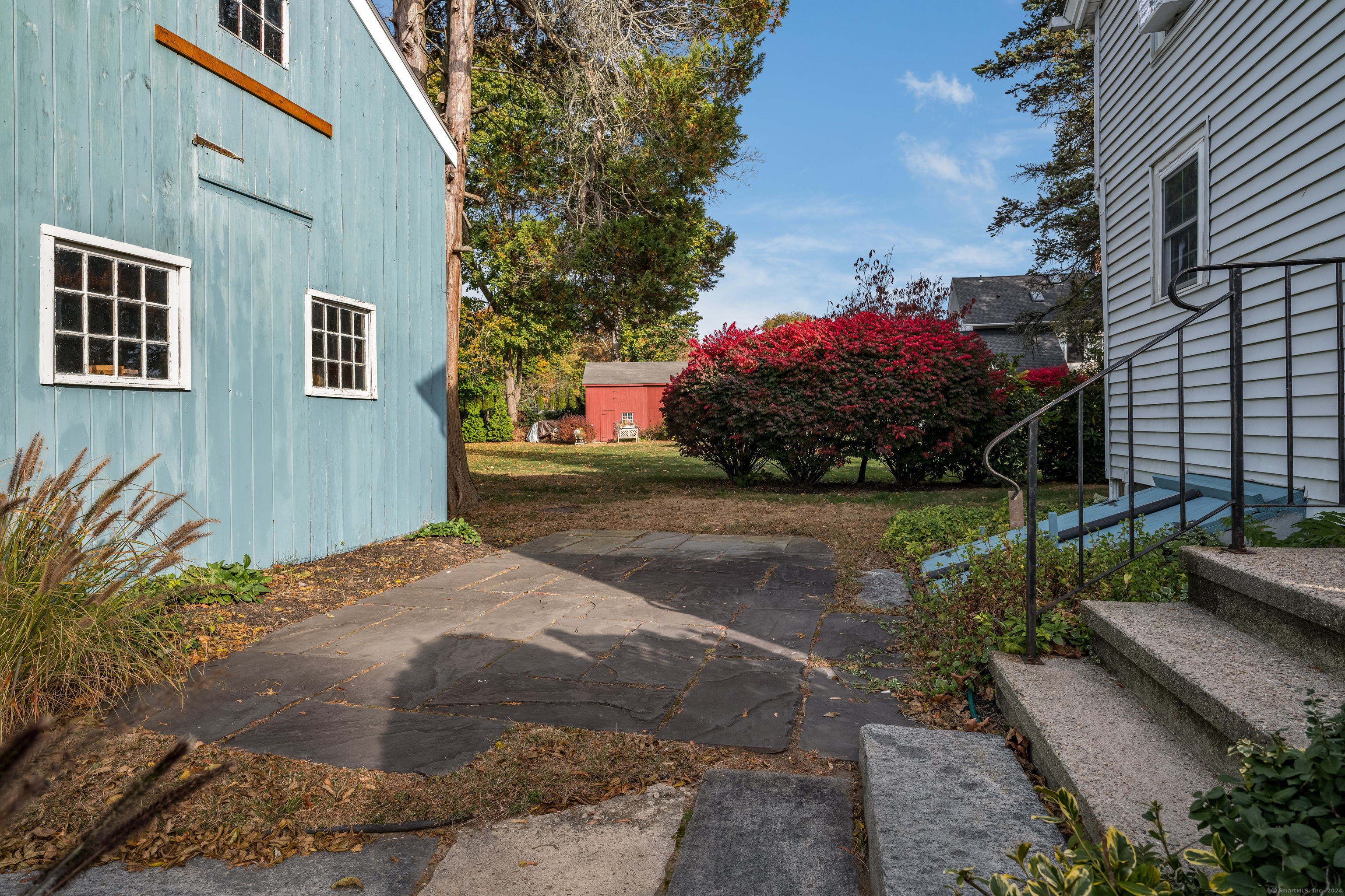 97 Commerce Street Clinton, CT 06413 - Photo 19 of 20 Outside patio area with shed for storage.