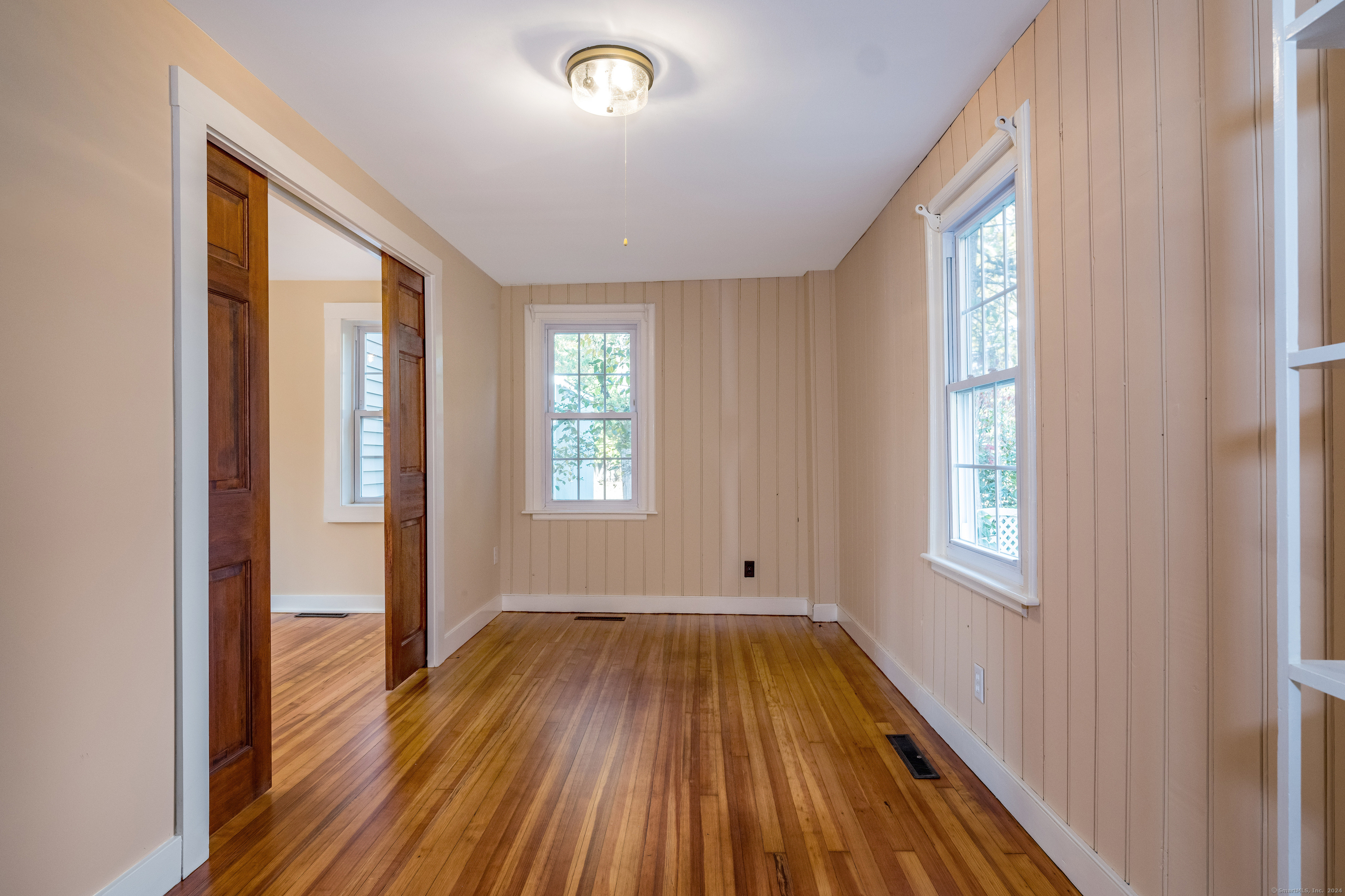 97 Commerce Street Clinton, CT 06413 - Photo 8 of 20 Bedroom/office with pocket doors for privacy.