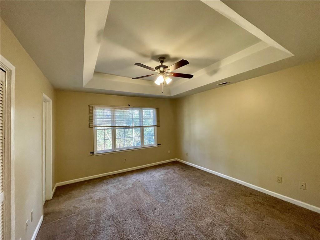 256 Robbie Lane Marietta, GA 30060 - Photo 10 of 17 an empty room with windows and fan