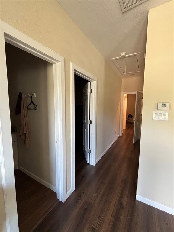 343 North Morris Street Gainesville, TX 76240 - Photo 11 of 18 a view of a hallway with wooden floor
