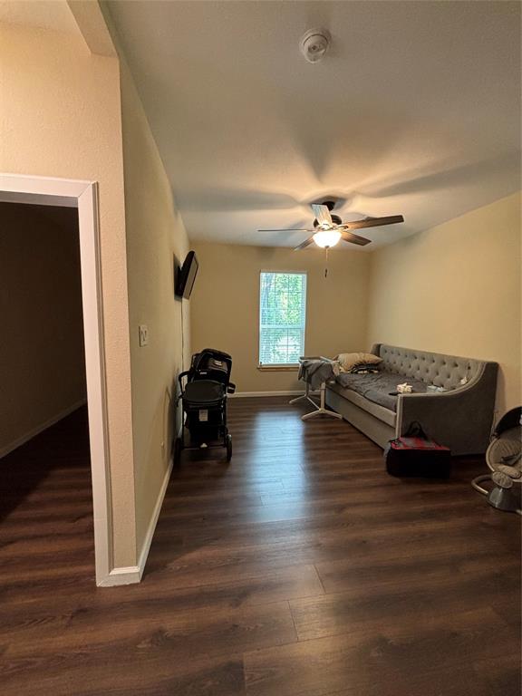 343 North Morris Street Gainesville, TX 76240 - Photo 12 of 18 a living room with furniture and a chandelier
