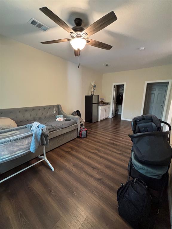 343 North Morris Street Gainesville, TX 76240 - Photo 5 of 18 a bedroom with furniture and wooden floor