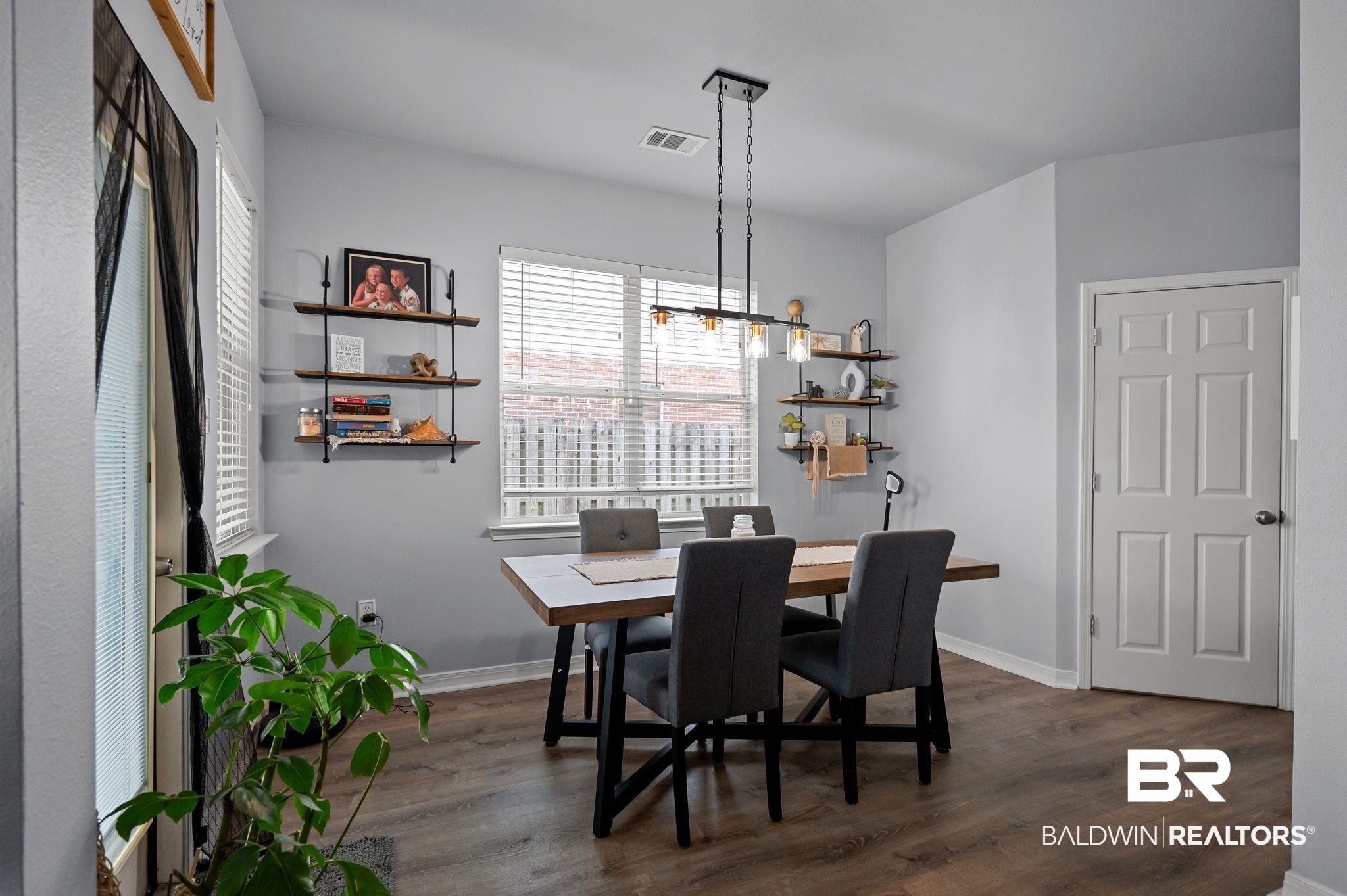 1287 Pembroke Way Foley, AL 36535 - Photo 12 of 39 Dining area with dark wood-type flooring and baseboards