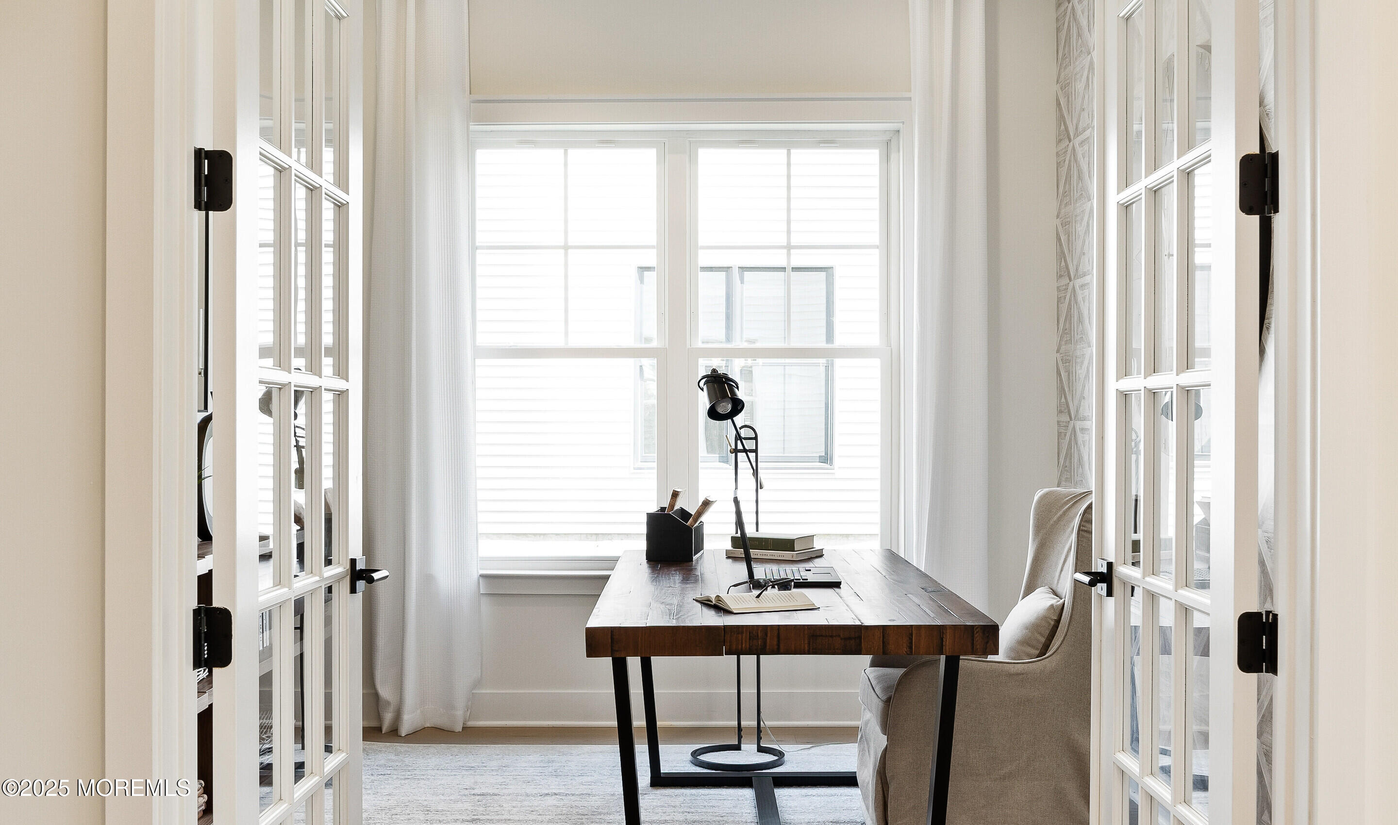 176 Highway 33, Unit IBIZA II LOFT Manalapan, NJ 07726 - Photo 2 of 39 a view of a workspace with furniture and a window
