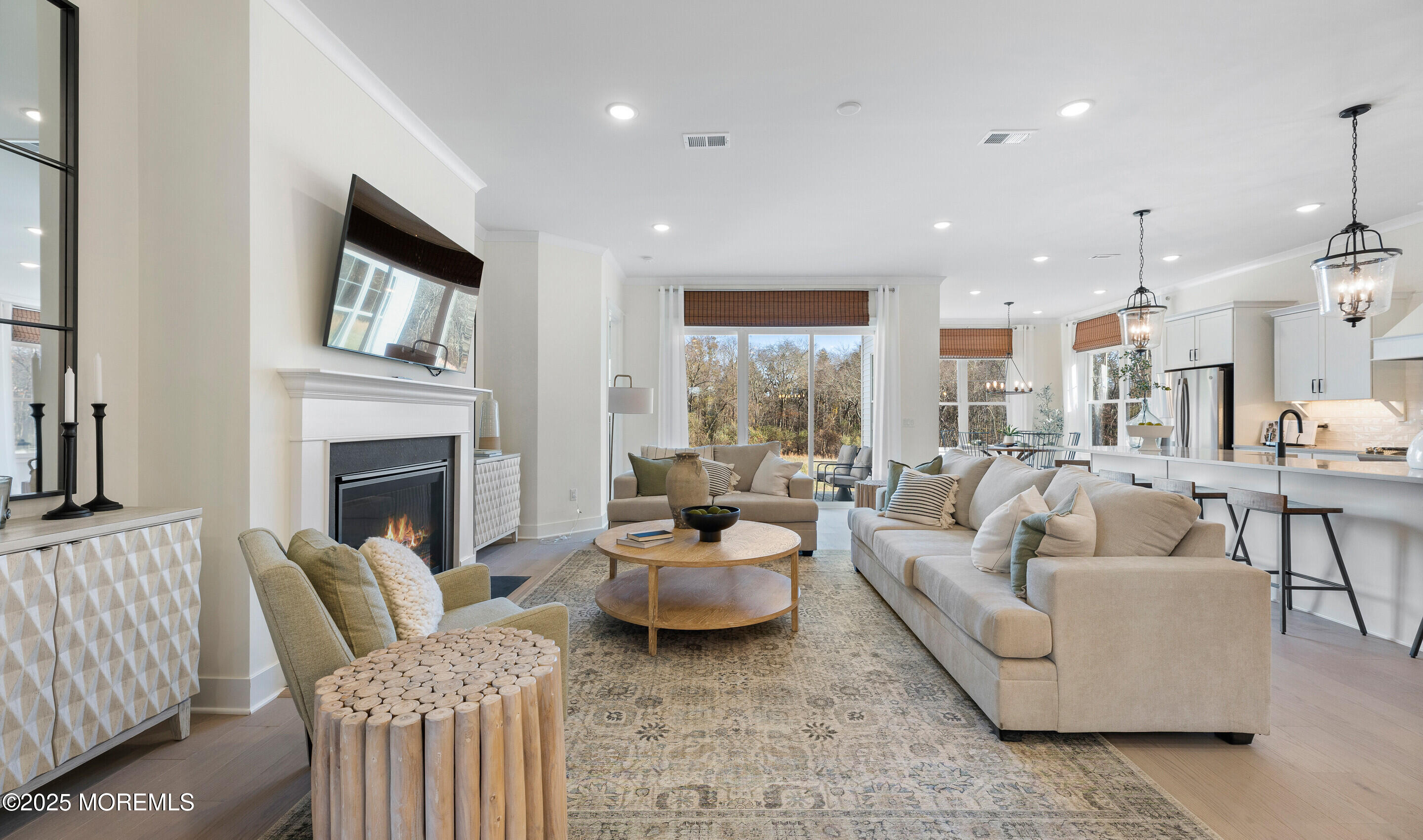 176 Highway 33, Unit IBIZA II LOFT Manalapan, NJ 07726 - Photo 31 of 39 a living room with furniture and a fireplace