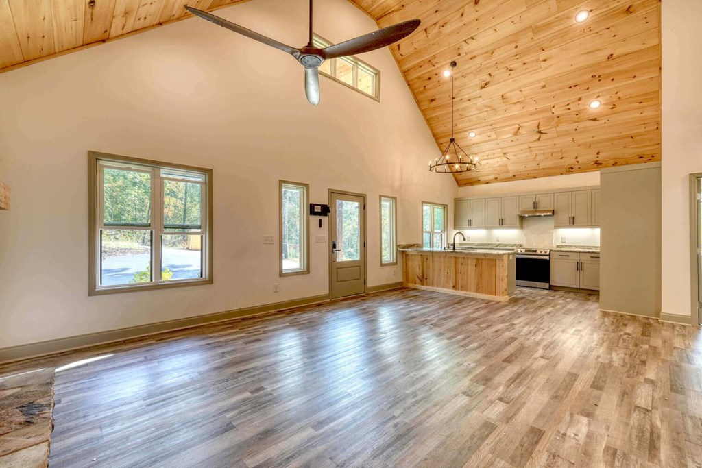 63 Nottaway Road Young Harris, GA 30582 - Photo 12 of 35 a view of empty room with wooden floor and windows
