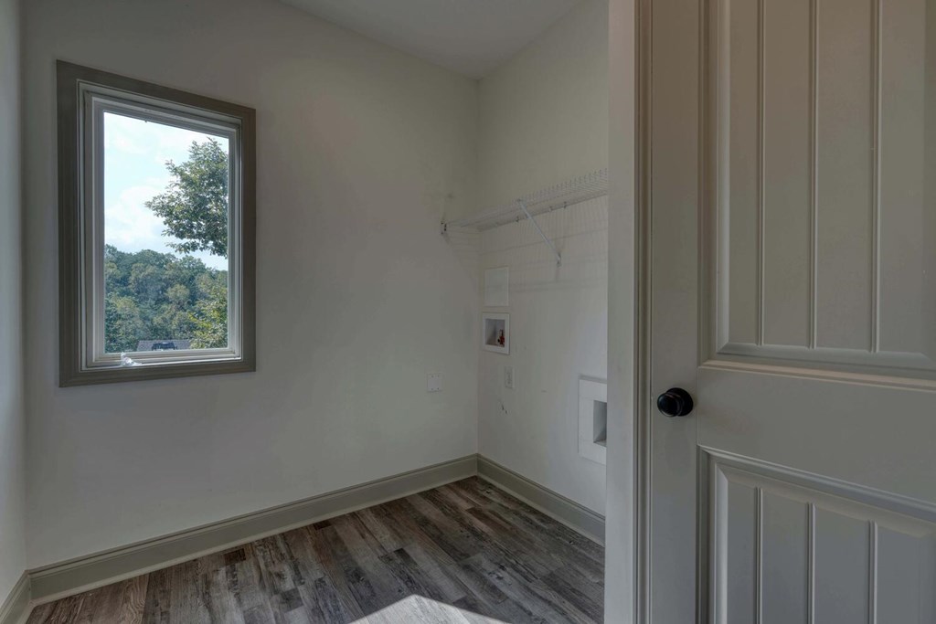 63 Nottaway Road Young Harris, GA 30582 - Photo 26 of 35 a view of an empty room with wooden floor and a window