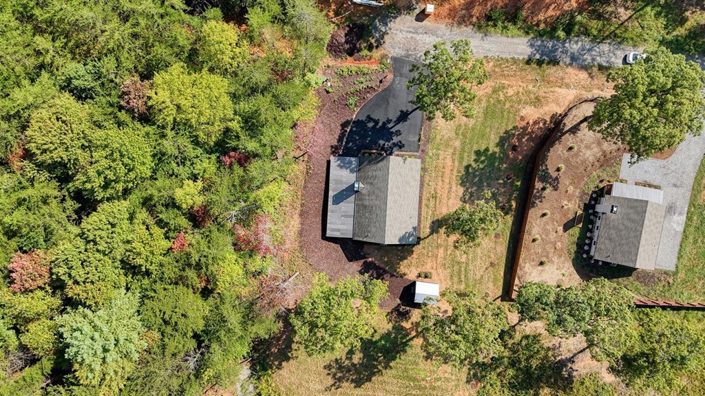 63 Nottaway Road Young Harris, GA 30582 - Photo 30 of 35 an aerial view of a house with yard and parking