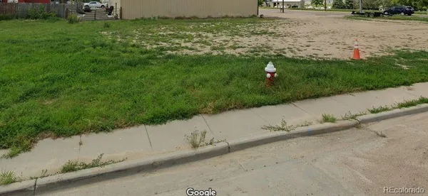 a view of backyard with green space