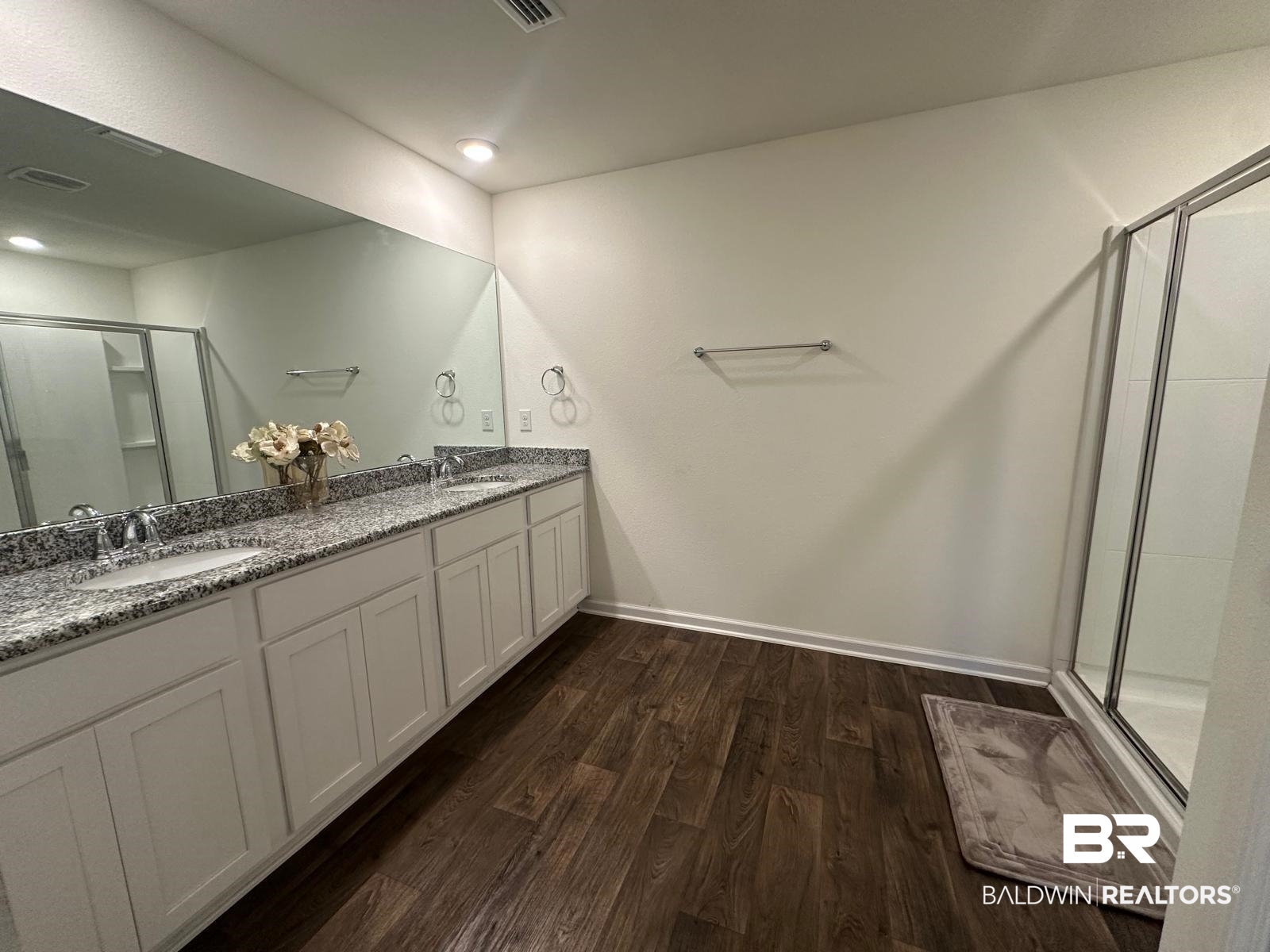 23792 Unbridled Loop Daphne, AL 36526 - Photo 19 of 36 Bathroom featuring a stall shower, dark wood-type flooring, and double vanity