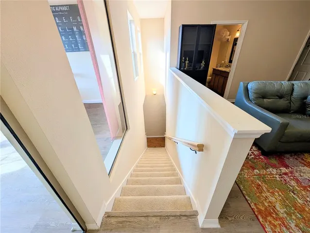 a view of stairs and furniture