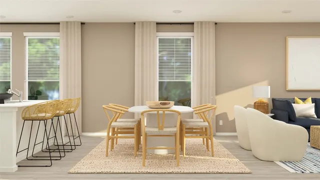 a view of a dining room with furniture and a window