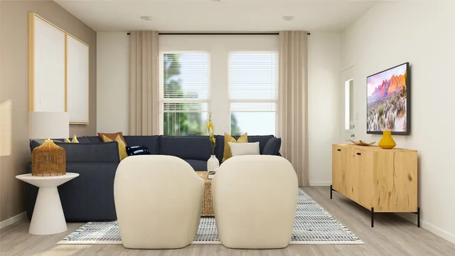 a living room with furniture a window and a lamp